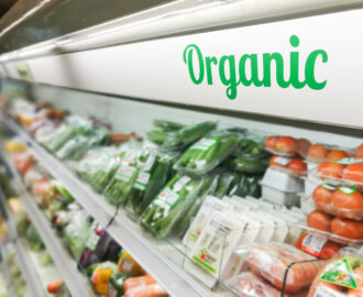 Organic food signage on modern supermarket fresh produce vegetable aisle to appeal to healthy lifestyle shoppers